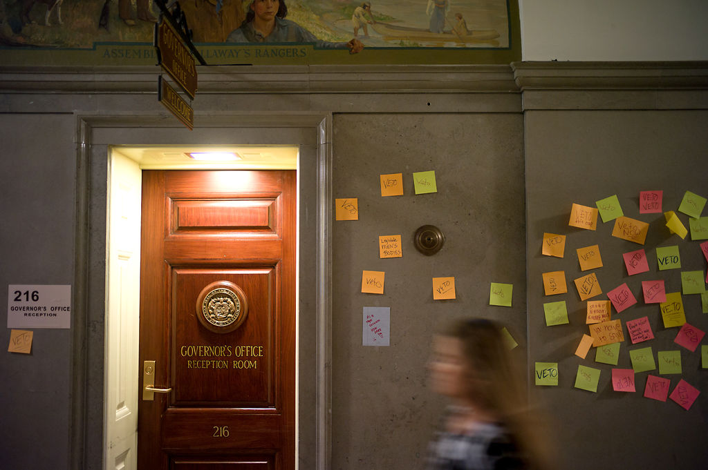Paper notes stick to the walls near the entrance of the Missouri Governor's Office